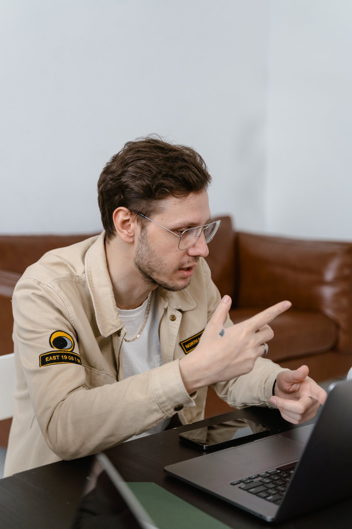 A Man Talking while Wearing Eyeglasses